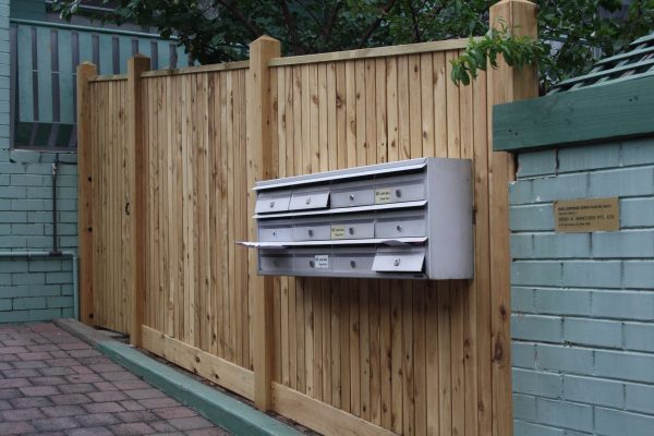 Feature Picket fence with Exposed posts and Gabled Lipped Capping. Letterbox bank fitted into front fence